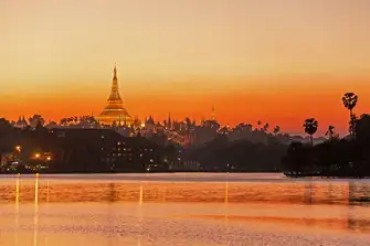 The Shwedagon Pagoda, home to revered Buddhist relics, has towered over an ever-changing Yangon city since at least the mid-14th century