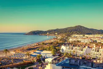 Platja d'en Bossa is home to superclub Hï and many beach nightclubs like Ushuaia. This is the view south from Hard Rock Hotel