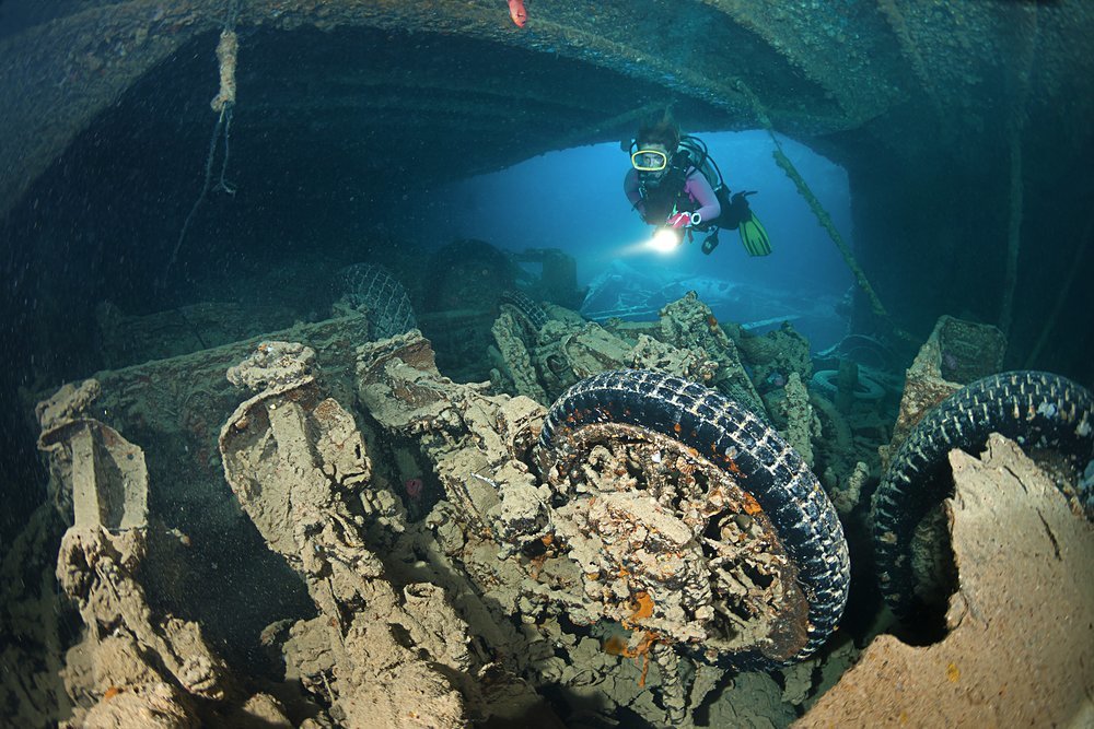 Swim through the ship and discover the various military kits and items that were carried on board