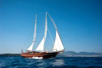 The traditional sailing gulets still ply their trade, albeit a different one, in these crystal clear waters