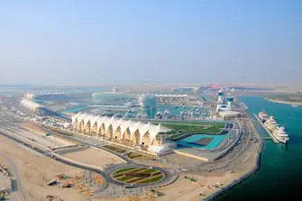 Ferrari World, the red structure in the right of shot, is home to some wild rides, Italian cuisine and, of course, driving experiences