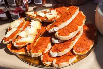 Picante sobrasada paired with Menorcan Mahón cheese on freshly made bread is a simple, rustic delight