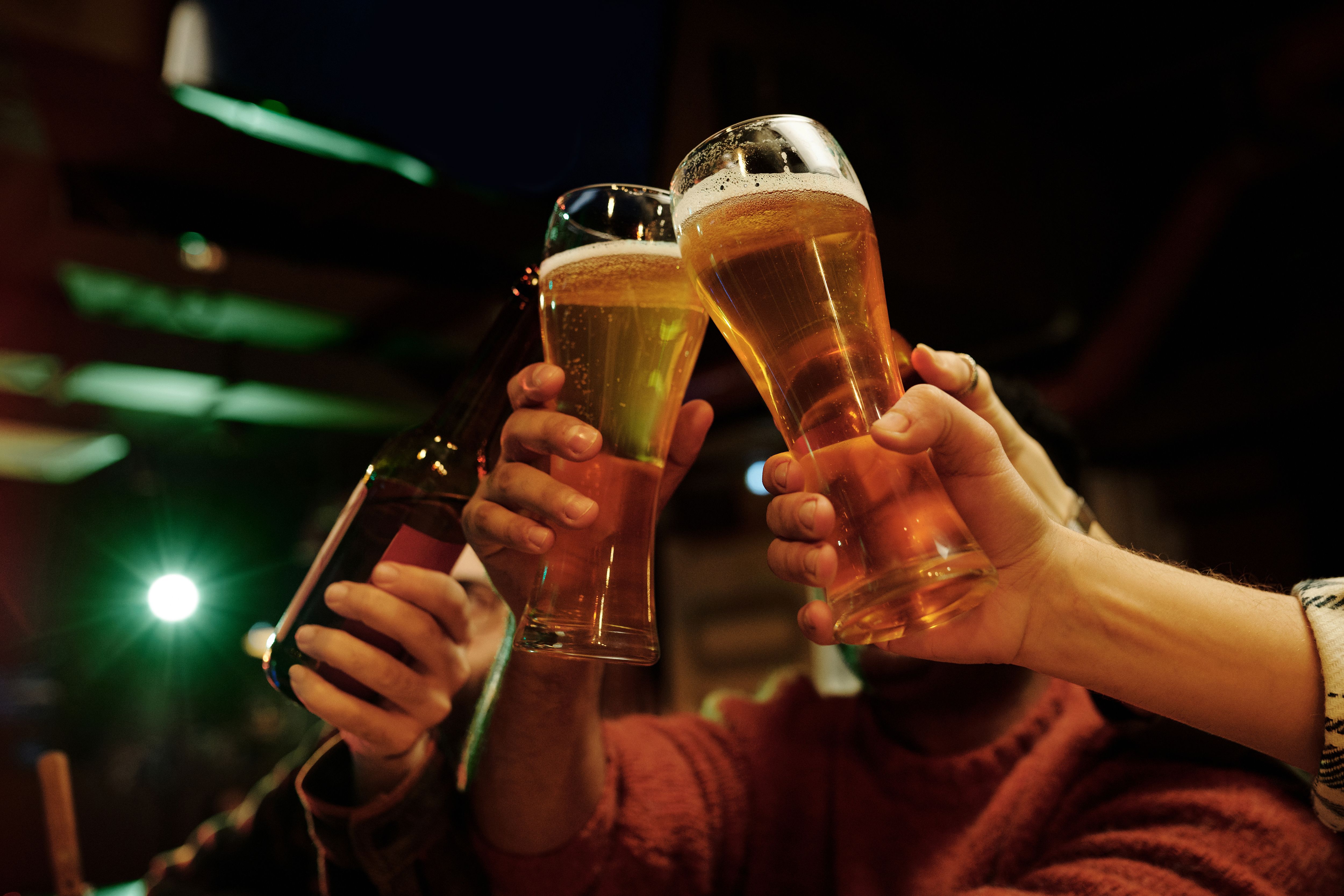 Clinking glasses of beer