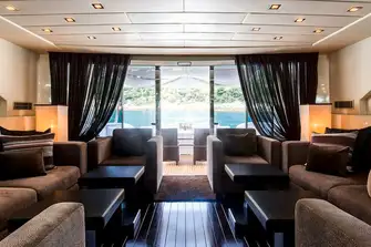 Looking aft through the main saloon towards the open-air dining and jacuzzi