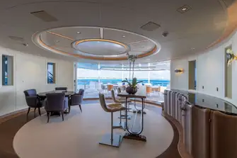 Looking aft past the bridge deck bar and lounge to the open-air dining area