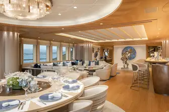 The dining table overlooks the main deck aft and the main saloon has huge picture windows