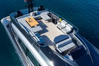 The flybridge has a helm station forward and lounging aft