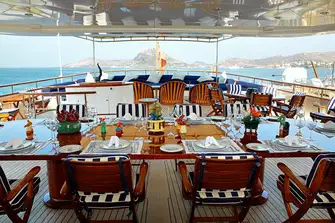 The sun lounge, pop-up TV and open-air dining on the upper deck aft, protected by sliding glass screens either side