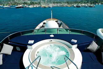 The forward sun deck has a sunpad-flanked jacuzzi and a sit-up wet bar
