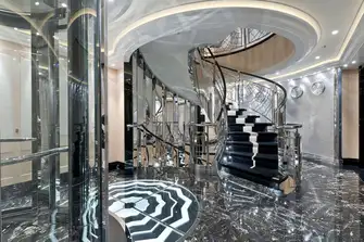 The steel and glass elevators, marble and rivetted aluminium staircase evoke the optimism of a new industrial age