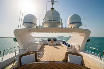 Looking forward, from the dining table to the lounge area and the flybridge