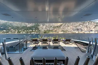 The view from the gym under the hardtop towards the sun lounge and cactus garden. Deck skylights are a feature throughout this yacht