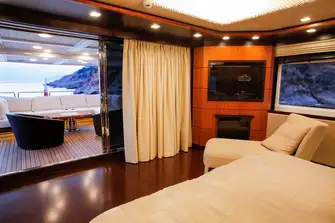 Aft on the upper deck, the master suite looks across its own terrace and has walkaround side decks for you to take in the 360 views 
