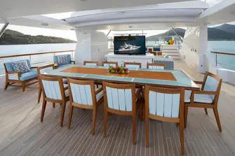 The sun deck has a jacuzzi, wet bar and BBQ forward, a lounge and dining area beneath the retractable bimini