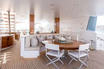TALISMAN C - Looking forward from the sun lounge aft past the dining table, bar and daybed to the jacuzzi forward
