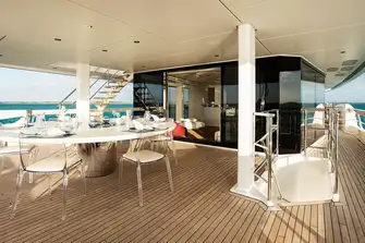 Open-air dining on the upper deck aft