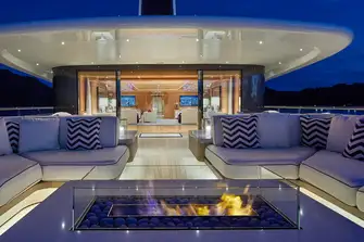 A mesmerising firepit is the focus of the lounge outside the bridge deck games room