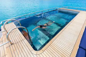 The swimming pool is the main feature on a huge main deck aft