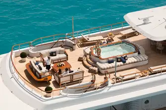 Sun lounge aft, large jacuzzi midships and shaded dining forward