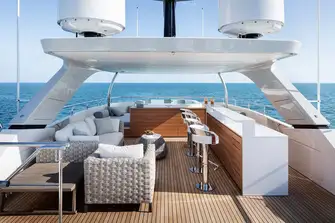 The sun deck with jacuzzi and sunpads forward, bar and lounge diner, with sun lounging deck aft