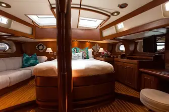 The owner's suite is full beam with handrails above the berth for safety underway