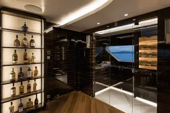 The clubroom's wine cellar and humidor, enjoy your cigar on the aft terrace