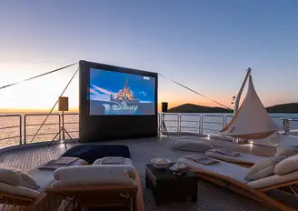 An outdoor cinema screen delivers movies under the stars