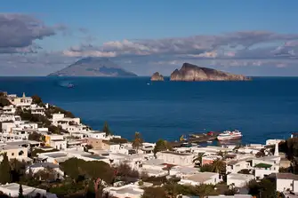 The view from Hotel Raya's roof terrace looks over the town of Panarea to Stromboli in the far distance