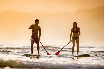 What could be more romantic than paddleboarding into the sunset together?