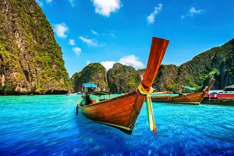 One of Thailand's coastal signatures is the longtail boat, like this one in Maya Bay on Phi Phi Leh