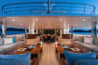 The main deck aft features open air dining and a lounge area, another huge entertaining space that also delivers an intimate family feel