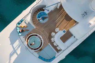 The sun deck jacuzzi and fully equipped bar, there is a sun lounge aft