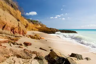 The sandstone cliffs enclosing Cupecoy Bay in far west Sint Maarten