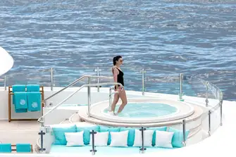 Soak up the sun and sip on a cocktail as you relax in the yacht's sun deck jacuzzi