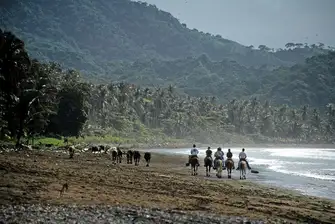 Go horse-riding next to the Pacific Ocean along unspoilt Tambor Beach