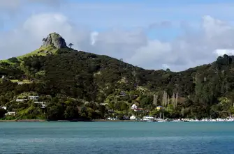 St Paul's Rock stands sentinel over Whangaroa Harbour