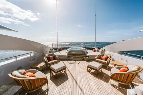 Sun deck jacuzzi, sitting area and sunpads